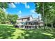 The backyard features an outdoor patio with a hot tub, grilling area, and lounge seating at 8261 Twin Pointe Cir, Indianapolis, IN 46236