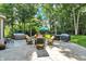 Spacious backyard with patio, outdoor seating, lush lawn, and hot tub at 8261 Twin Pointe Cir, Indianapolis, IN 46236