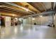 Unfinished basement with high ceilings and a clean, well-maintained concrete floor at 8261 Twin Pointe Cir, Indianapolis, IN 46236