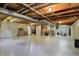 Spacious unfinished basement with exposed ceiling, utility pipes and concrete walls at 8261 Twin Pointe Cir, Indianapolis, IN 46236