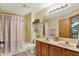 Bathroom features a shower-tub combo and a double vanity at 8261 Twin Pointe Cir, Indianapolis, IN 46236