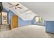 An airy bedroom has blue walls, neutral carpet, and a bright window at 8261 Twin Pointe Cir, Indianapolis, IN 46236