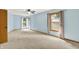 Inviting bedroom featuring light blue walls, natural light, and plush carpeting at 8261 Twin Pointe Cir, Indianapolis, IN 46236