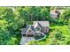 Aerial view of a two story brick home with a manicured front yard and a two car garage at 8261 Twin Pointe Cir, Indianapolis, IN 46236