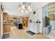 Open kitchen with stainless steel appliances, a center island, and wooden floors at 8261 Twin Pointe Cir, Indianapolis, IN 46236