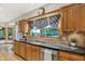 Granite countertops and stainless steel appliances highlight this charming kitchen space at 8261 Twin Pointe Cir, Indianapolis, IN 46236