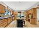 Well-lit kitchen boasting stainless steel appliances, granite countertops, and a center island at 8261 Twin Pointe Cir, Indianapolis, IN 46236