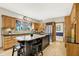 Spacious kitchen featuring granite counters, stainless appliances, and a large center island at 8261 Twin Pointe Cir, Indianapolis, IN 46236