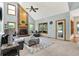 Spacious living room featuring a cozy seating arrangement and a large window, with lots of natural light at 8261 Twin Pointe Cir, Indianapolis, IN 46236