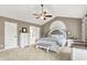 Well-lit main bedroom with vaulted ceilings, a ceiling fan, and coordinated furniture at 8261 Twin Pointe Cir, Indianapolis, IN 46236