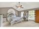Spacious main bedroom with vaulted ceilings, ceiling fan, and bright windows at 8261 Twin Pointe Cir, Indianapolis, IN 46236