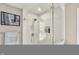 Contemporary shower featuring white subway tile and a glass door, offering a clean, modern design at 8261 Twin Pointe Cir, Indianapolis, IN 46236