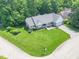 Aerial view of lovely single-story home with well-kept lawn, mature trees, and inviting curb appeal at 8429 Catamaran Dr, Indianapolis, IN 46236