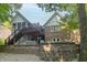 Beautiful backyard featuring a stone patio with seating, outdoor lights, and a covered porch at 8429 Catamaran Dr, Indianapolis, IN 46236