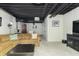Spacious finished basement offering a large seating area, bar setup, and entertainment space at 8429 Catamaran Dr, Indianapolis, IN 46236