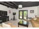 Cozy finished basement with comfortable seating, entertainment center, and walkout access to the patio at 8429 Catamaran Dr, Indianapolis, IN 46236