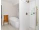 Bright bathroom with a soaking tub, glass-enclosed shower, and stylish fixtures and decor at 8429 Catamaran Dr, Indianapolis, IN 46236