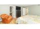Comfortable bedroom with a TV, dresser, and access to a well-lit, modern bathroom at 8429 Catamaran Dr, Indianapolis, IN 46236