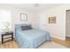 Comfortable bedroom featuring bright light, wood floors and soothing wall art at 8429 Catamaran Dr, Indianapolis, IN 46236