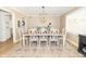 Charming dining room with a stylish chandelier, large table with seating for eight, and bright natural light at 8429 Catamaran Dr, Indianapolis, IN 46236