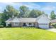 Charming single-story home with a well-manicured lawn, brick accents, and an attached two-car garage at 8429 Catamaran Dr, Indianapolis, IN 46236