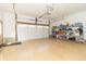 This expansive garage features painted floors, abundant storage, and an automatic door with convenient access at 8429 Catamaran Dr, Indianapolis, IN 46236