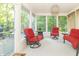 Bright sunroom filled with natural light, featuring comfortable seating and views of the surrounding greenery at 8429 Catamaran Dr, Indianapolis, IN 46236