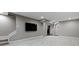 Spacious finished basement with modern gray carpet, recessed lighting, and a large-screen TV at 8720 N Deer Crossing Blvd, McCordsville, IN 46055