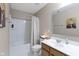 Neutral bathroom with shower-tub combo, wood vanity with white sink and beige walls at 8720 N Deer Crossing Blvd, McCordsville, IN 46055