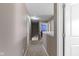 Second story hallway featuring neutral carpeting and multiple doorways at 8720 N Deer Crossing Blvd, McCordsville, IN 46055