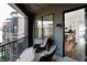 Cozy balcony with comfortable seating and a view of the surrounding buildings and neighborhood at 920 Veterans Way # 204, Carmel, IN 46032