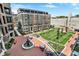 Beautiful brick courtyard featuring a fountain, seating areas, and a meticulously landscaped green space for residents to enjoy at 920 Veterans Way # 204, Carmel, IN 46032