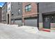 Attached garages for townhomes with address signage, providing convenient parking and street access at 920 Veterans Way # 204, Carmel, IN 46032