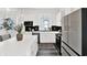 Bright kitchen featuring white cabinets, modern appliances, and an island, providing ample counter space for food preparation at 920 Veterans Way # 204, Carmel, IN 46032
