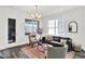 Stylish living room showcasing a comfortable sofa, accent chairs, and contemporary decor at 920 Veterans Way # 204, Carmel, IN 46032