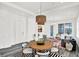 Bright and open living space with a stylish dining table and comfortable lounge area at 920 Veterans Way # 204, Carmel, IN 46032