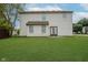 This home features a large, well maintained lawn and a modest patio at 10420 Day Star Dr, Indianapolis, IN 46234