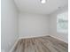 This bedroom features neutral paint, wood-look flooring, and lots of natural light at 10420 Day Star Dr, Indianapolis, IN 46234