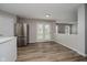 Dining area with wood-look floors, stainless steel refrigerator and access to the backyard at 10420 Day Star Dr, Indianapolis, IN 46234