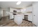 Bright kitchen with an island, stainless steel appliances, and white cabinets at 10420 Day Star Dr, Indianapolis, IN 46234