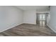 Open living space with wood-look floors, neutral walls, and lots of natural light at 10420 Day Star Dr, Indianapolis, IN 46234