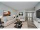 Inviting living room with neutral tones, modern decor, plush rug, and ample natural light at 10420 Day Star Dr, Indianapolis, IN 46234
