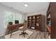Cozy office with built-in shelving and a modern desk setup at 10420 Day Star Dr, Indianapolis, IN 46234