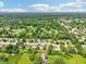 Aerial view showcases a residential neighborhood with mature trees, neat landscaping and well-spaced homes at 10444 Indian Lake N Blvd, Indianapolis, IN 46236