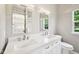 Bright bathroom with double sinks and ample natural light at 10444 Indian Lake N Blvd, Indianapolis, IN 46236