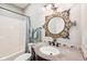 Charming bathroom with granite vanity and mosaic-tiled mirror at 10444 Indian Lake N Blvd, Indianapolis, IN 46236