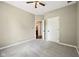 The carpeted bedroom with neutral walls and a white door at 10444 Indian Lake N Blvd, Indianapolis, IN 46236