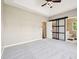 Bright bedroom with tray ceiling, doors leading to bathroom and closet at 10444 Indian Lake N Blvd, Indianapolis, IN 46236