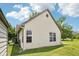 Back exterior of home with lush lawn at 10444 Indian Lake N Blvd, Indianapolis, IN 46236