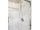 Modern shower with elegant marble-style tiling and glass door at 10444 Indian Lake N Blvd, Indianapolis, IN 46236